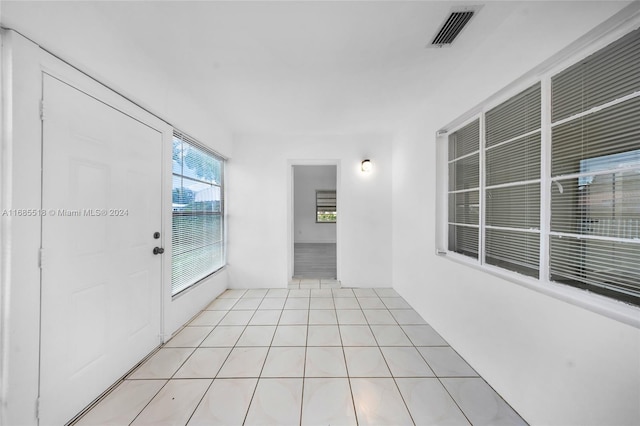 unfurnished room with light tile patterned floors