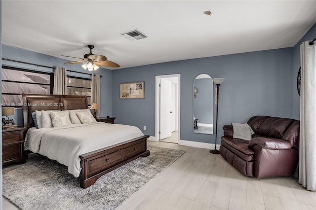 bedroom with light wood-type flooring and ceiling fan