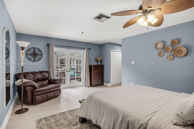 bedroom with french doors, light wood-type flooring, a closet, ceiling fan, and access to exterior