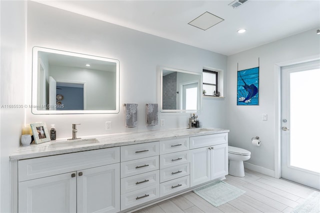 bathroom with vanity and toilet