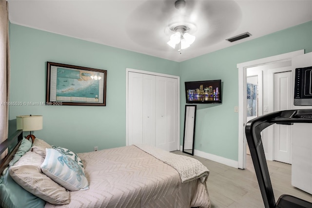 bedroom featuring ceiling fan and light hardwood / wood-style flooring