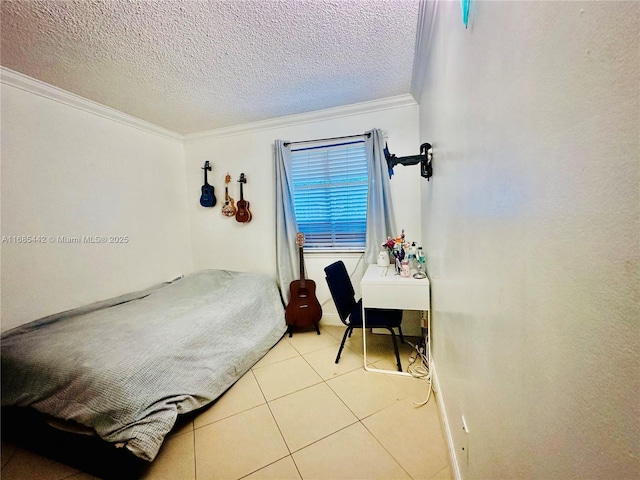 bedroom featuring ornamental molding, light tile patterned floors, and a textured ceiling