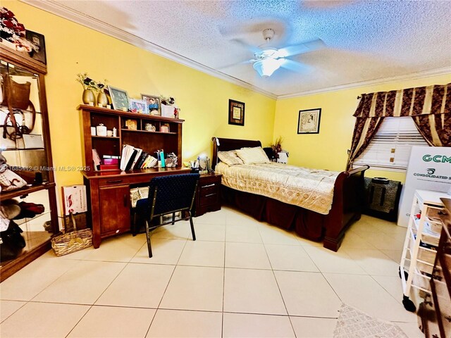 tiled bedroom featuring ceiling fan, a textured ceiling, and crown molding