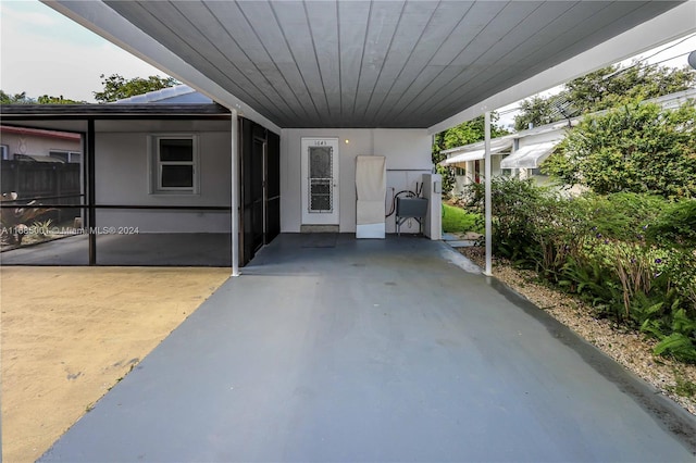 view of patio / terrace with a carport and sink