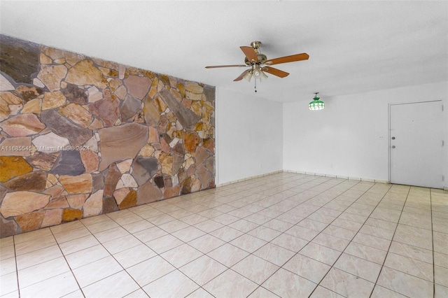 tiled empty room with ceiling fan