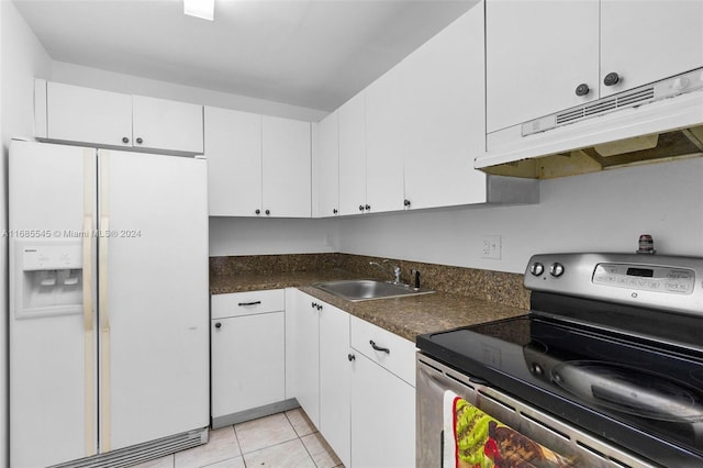 kitchen featuring sink, stainless steel electric range, white refrigerator with ice dispenser, and white cabinets