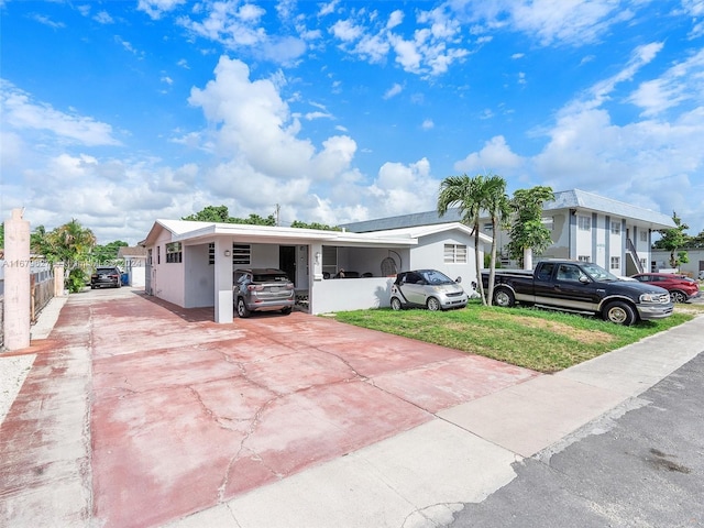 view of front of home featuring a carport