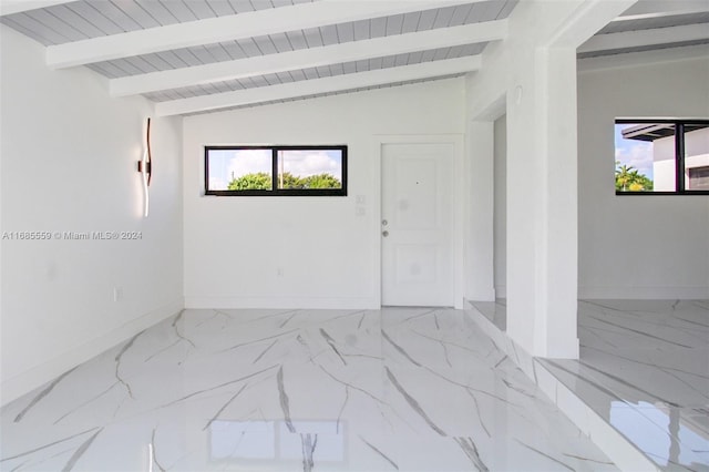 empty room featuring vaulted ceiling with beams and wood ceiling