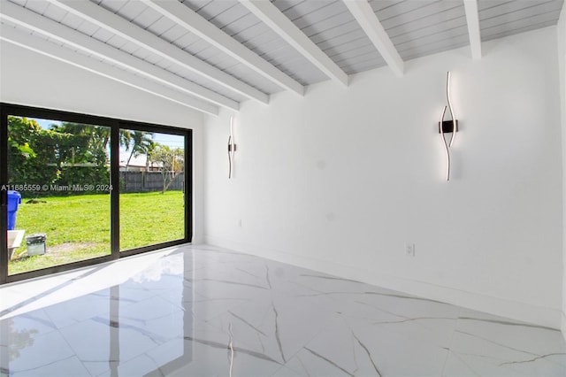 empty room featuring vaulted ceiling with beams and wooden ceiling