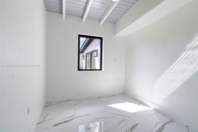 unfurnished room featuring beam ceiling and wooden ceiling