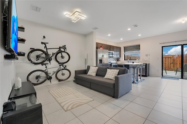 living room with light tile patterned flooring