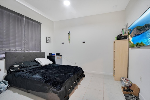 bedroom featuring light tile patterned flooring