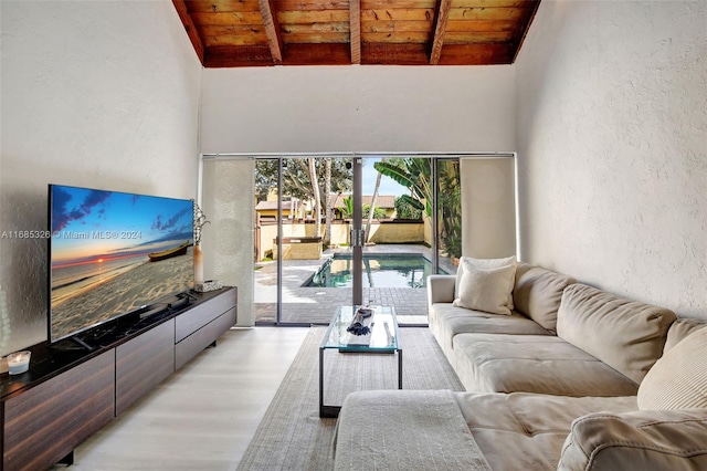 living room featuring wood ceiling, lofted ceiling with beams, and light wood-type flooring