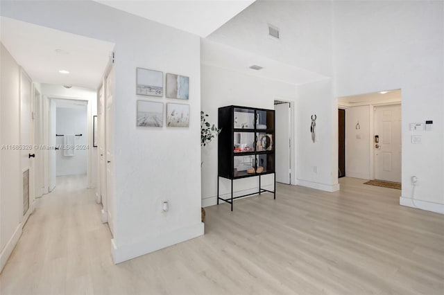 hall with light hardwood / wood-style floors