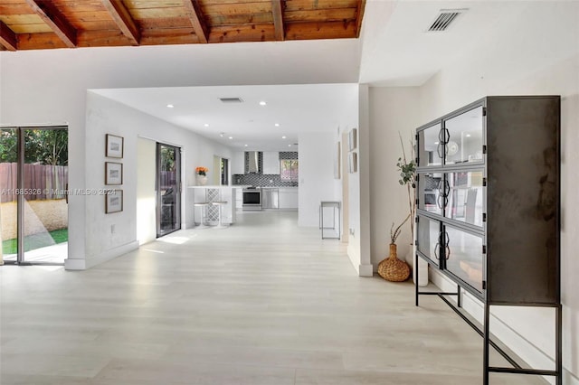 hall featuring wood ceiling, beam ceiling, and light wood-type flooring