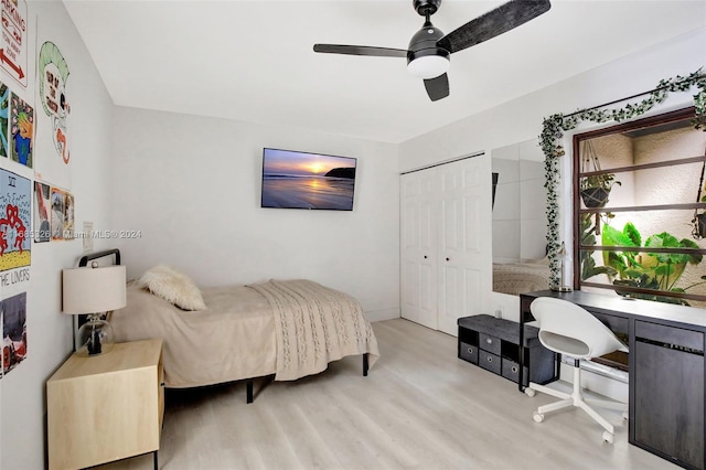 bedroom featuring a closet, ceiling fan, and light hardwood / wood-style flooring