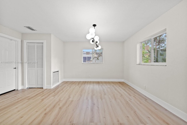 empty room with light hardwood / wood-style floors