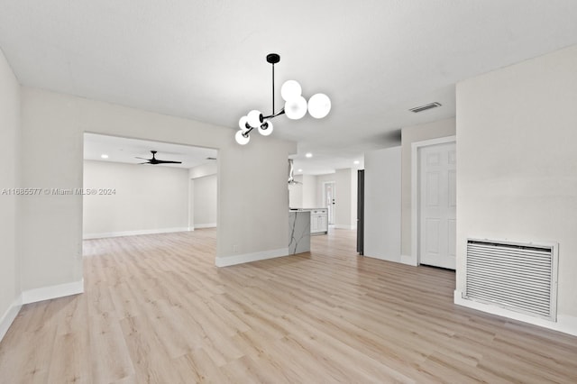 interior space with ceiling fan and light hardwood / wood-style flooring