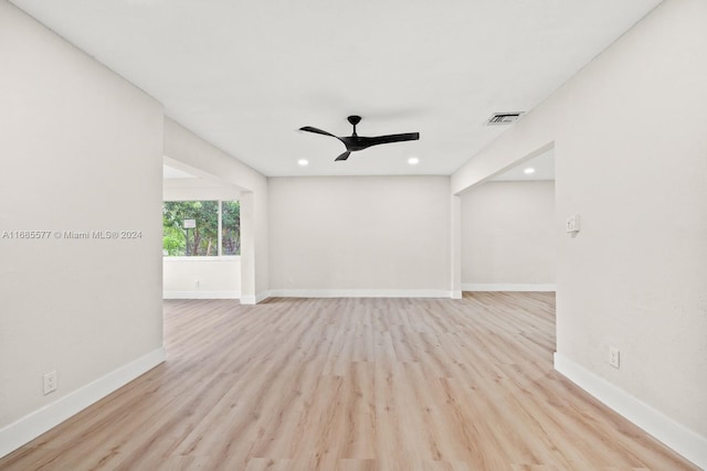 empty room featuring light hardwood / wood-style floors and ceiling fan