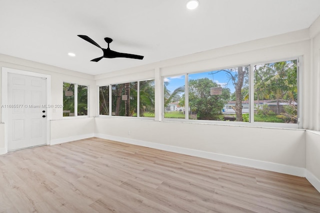 1410 NW 56th Ave, Lauderhill, FL 33313 - unfurnished sunroom featuring baseboards, wood finished floors, recessed lighting, and a deck
