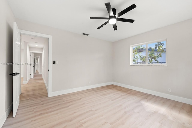 spare room with light hardwood / wood-style floors and ceiling fan