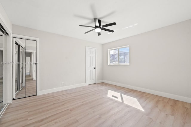 unfurnished room with ceiling fan and light hardwood / wood-style flooring