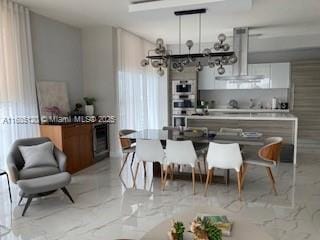 dining room featuring marble finish floor