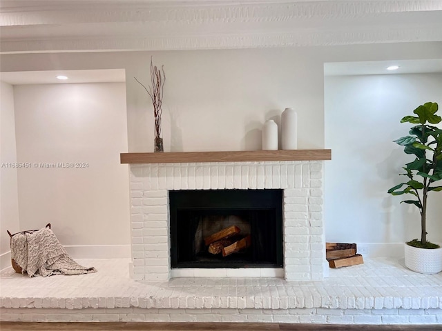 room details featuring a brick fireplace