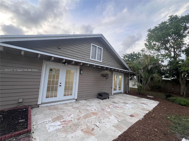 rear view of house with french doors and a patio