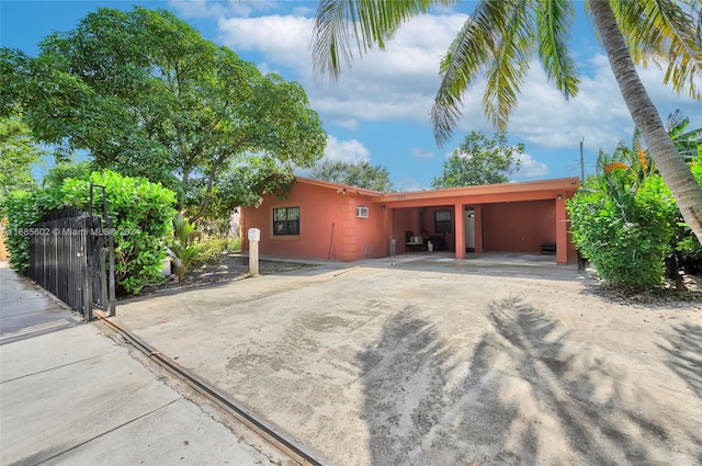 exterior space with a carport