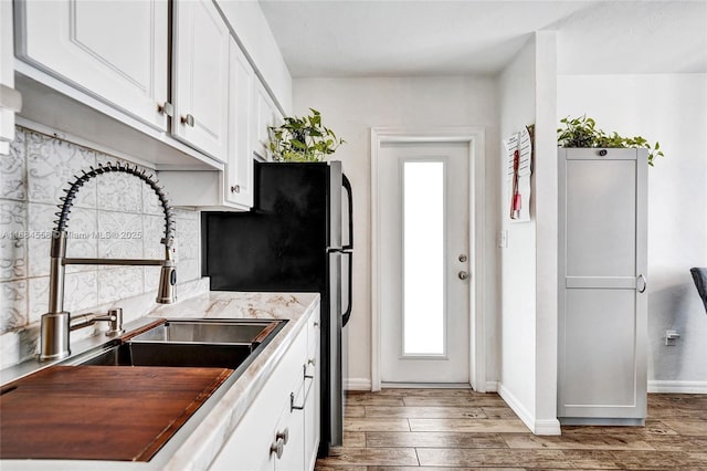 kitchen featuring sink, white cabinets, and dark hardwood / wood-style flooring