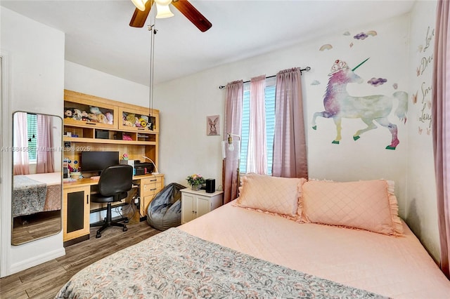 bedroom featuring ceiling fan and hardwood / wood-style floors