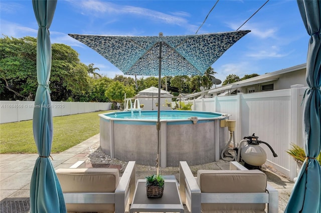 view of pool featuring a patio area and a lawn