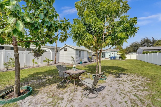 view of yard with an outbuilding