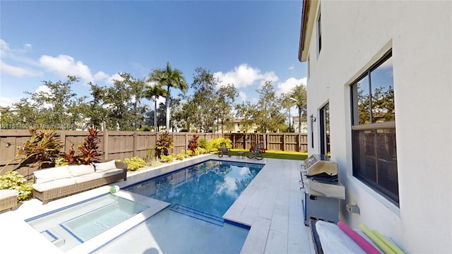 view of swimming pool featuring an in ground hot tub