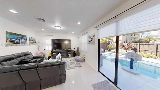 living room featuring lofted ceiling