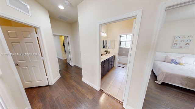 corridor featuring dark wood-type flooring