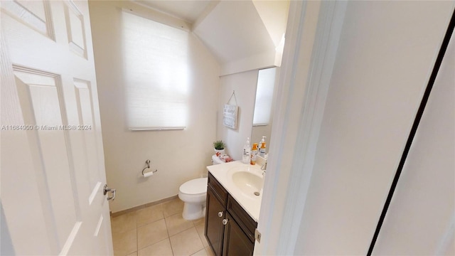 bathroom with tile patterned floors, vanity, and toilet