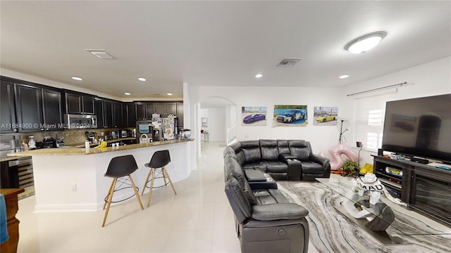 tiled living room with beverage cooler