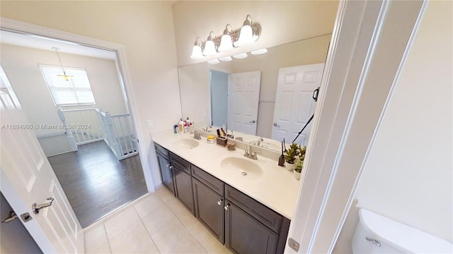 bathroom featuring hardwood / wood-style floors, vanity, and toilet