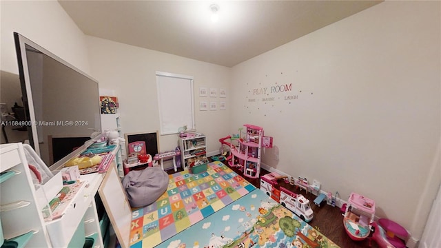 game room with hardwood / wood-style flooring