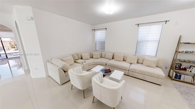 living room with tile patterned floors