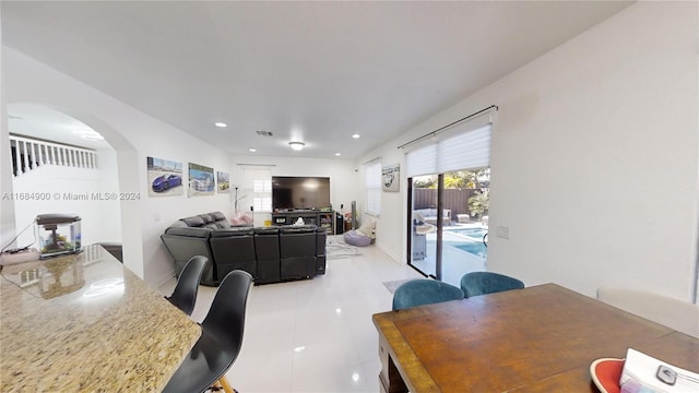 dining area featuring light tile patterned floors