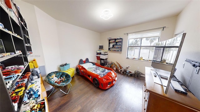 bedroom featuring dark hardwood / wood-style flooring