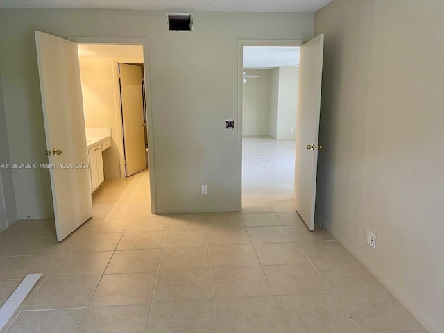 hallway with light tile patterned floors