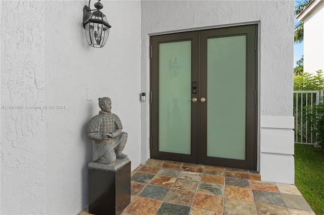 property entrance featuring french doors