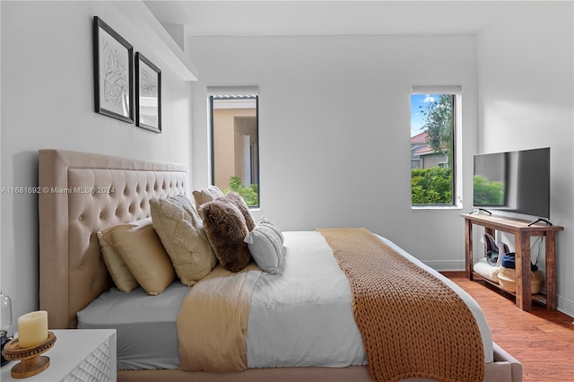 bedroom with wood-type flooring