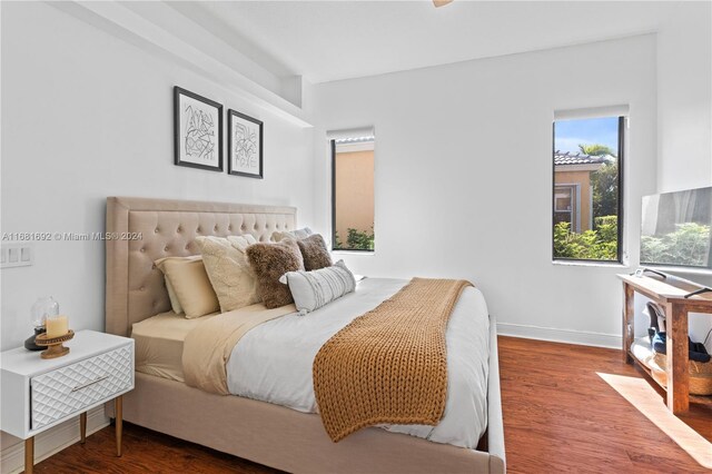 bedroom featuring dark hardwood / wood-style flooring