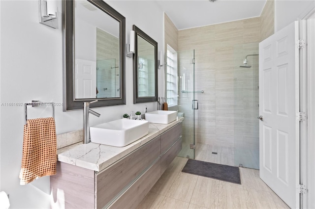 bathroom with vanity and an enclosed shower