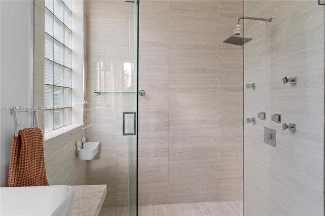 bathroom featuring an enclosed shower